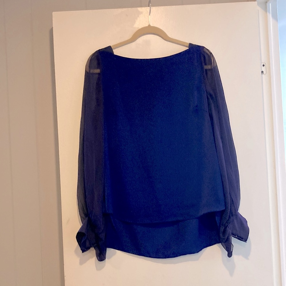 In good condition this purple T Tahari top is a small with sheer full sleeves